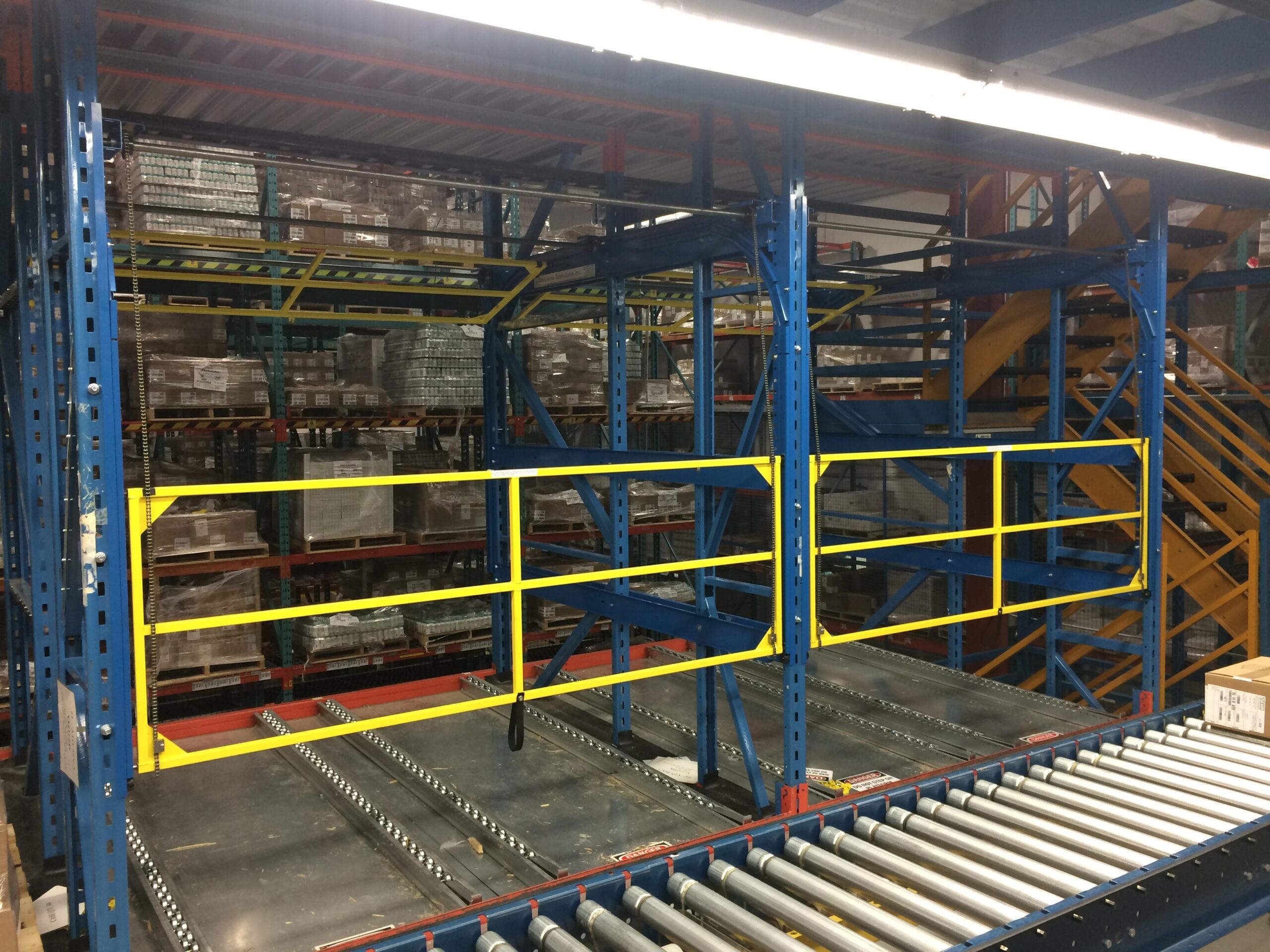 Safety gates for pallet flow lanes