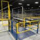 Open Top mezzanine safety gate providing fall protection at a pallet drop area