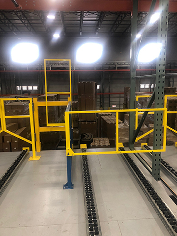 A Rack Supported Open Top safety gate in a pallet flow system