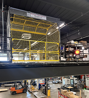 Pallet drop safety gate with pallet position indicator lights to assist forklift truck operators