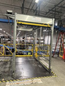 A power operated Roly safety gate makes an elevated pallet drop area safer for employees