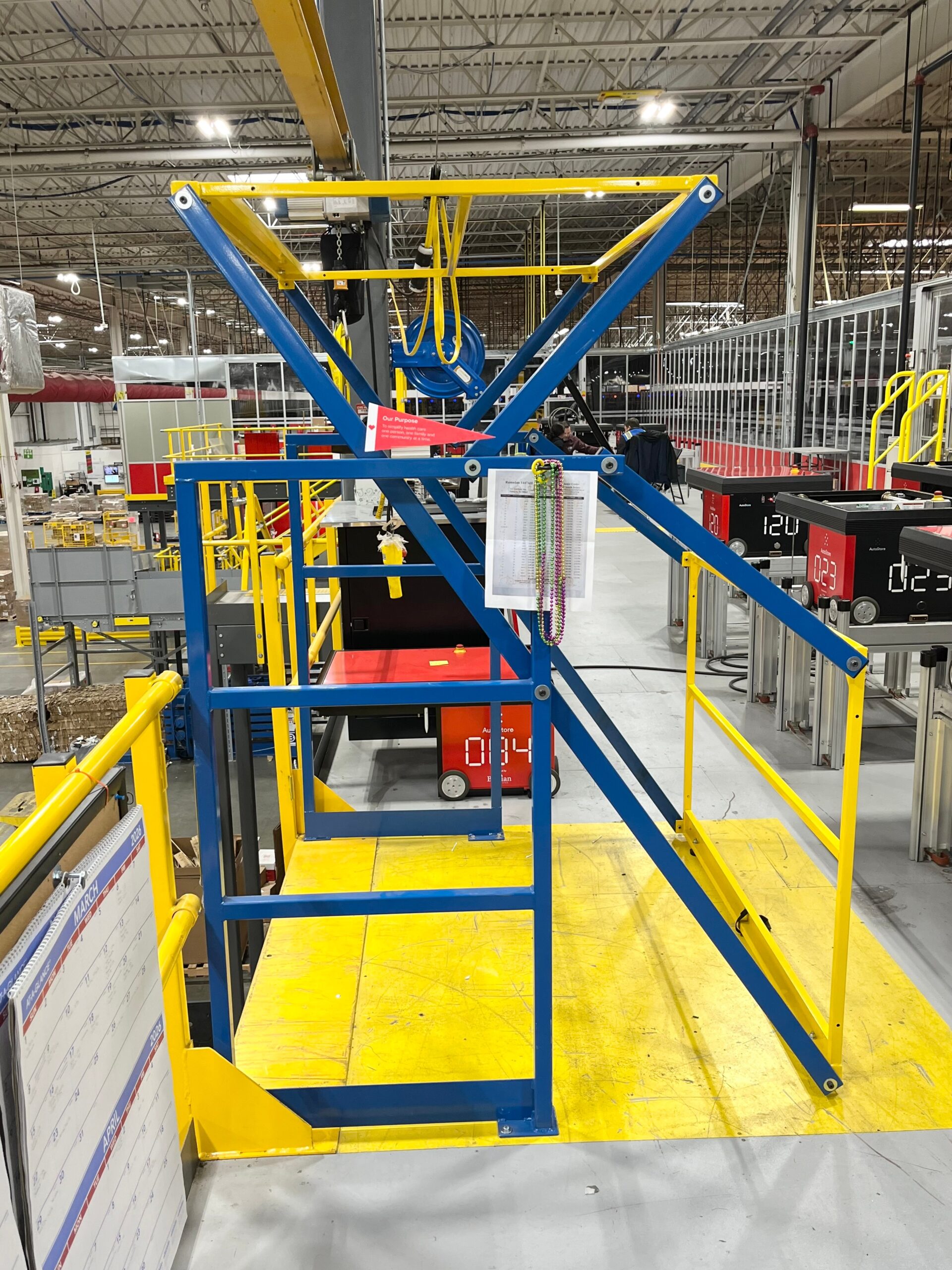 An industrial safety gate in a facility at a ledge in a AutoStore system will provide fall protection for employees working at the port,